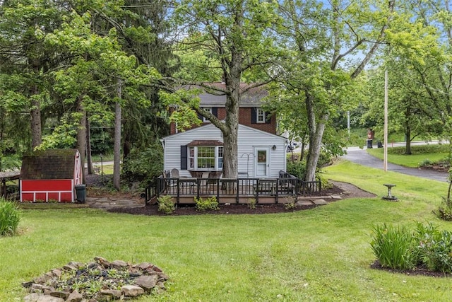 190 Wexford Bayne, Pine Twp Nal, PA 15090 - view of front facade with a deck, a front lawn, and a storage shed