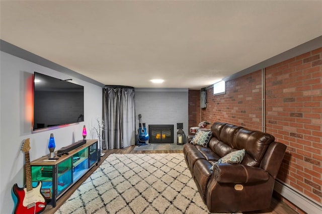 534 Ehman Ave, Baden, PA 15005 - living area with a baseboard radiator, wood finished floors, brick wall, and a fireplace