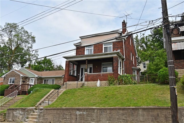 140 Saint Joseph St, Mount Oliver, PA 15210 - view of front of home with brick siding, stairway, a chimney, and a porch