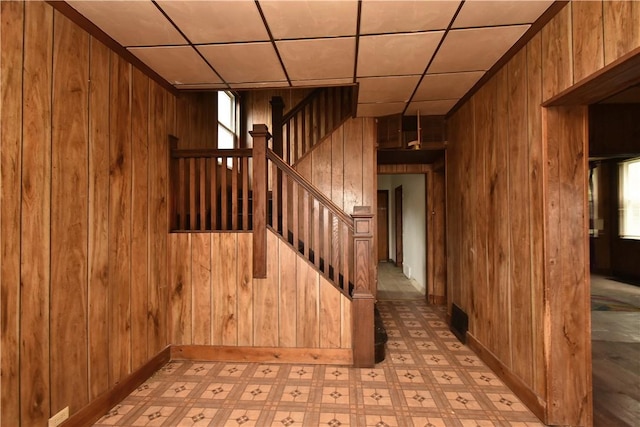 140 Saint Joseph St, Mount Oliver, PA 15210 - staircase featuring wood walls, tile patterned floors, and a drop ceiling