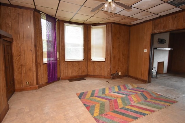 140 Saint Joseph St, Mount Oliver, PA 15210 - empty room with wooden walls, a ceiling fan, and a paneled ceiling