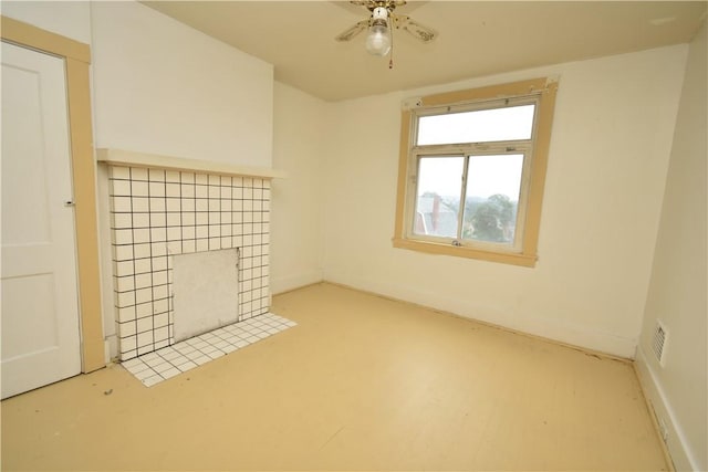 140 Saint Joseph St, Mount Oliver, PA 15210 - spare room featuring a ceiling fan and a tiled fireplace