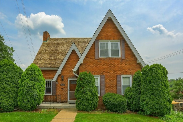 4101 Dalewood St, Brentwood, PA 15227 - tudor house featuring brick siding and a chimney