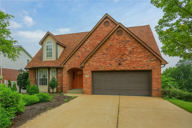 135 Jarod Dr, Moon/Crescent Twp, PA 15108 - view of front facade with brick siding, driveway, roof with shingles, and a garage