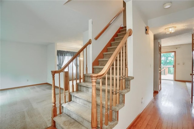 135 Jarod Dr, Moon/Crescent Twp, PA 15108 - staircase featuring baseboards and wood-type flooring