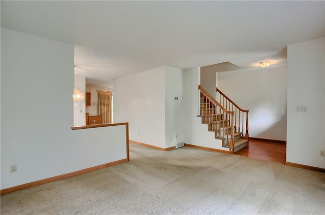 135 Jarod Dr, Moon/Crescent Twp, PA 15108 - carpeted spare room featuring baseboards and stairway