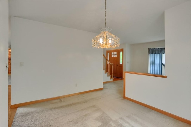135 Jarod Dr, Moon/Crescent Twp, PA 15108 - empty room featuring a chandelier, stairway, and light colored carpet