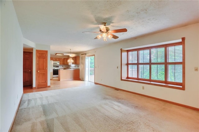 135 Jarod Dr, Moon/Crescent Twp, PA 15108 - unfurnished living room featuring light carpet and ceiling fan
