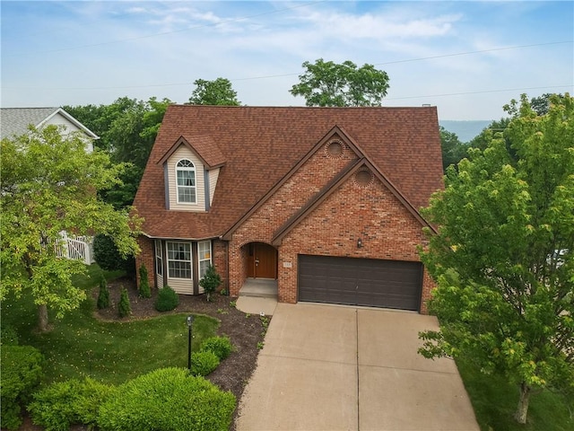 135 Jarod Dr, Moon/Crescent Twp, PA 15108 - view of front facade featuring brick siding, driveway, an attached garage, and roof with shingles