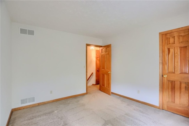 135 Jarod Dr, Moon/Crescent Twp, PA 15108 - spare room featuring light carpet and baseboards