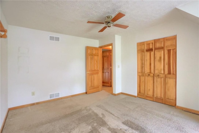 135 Jarod Dr, Moon/Crescent Twp, PA 15108 - unfurnished bedroom with light colored carpet, ceiling fan, a textured ceiling, and a closet