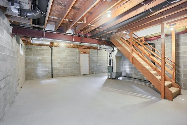 135 Jarod Dr, Moon/Crescent Twp, PA 15108 - unfinished basement with heating unit, stairway, and concrete block wall