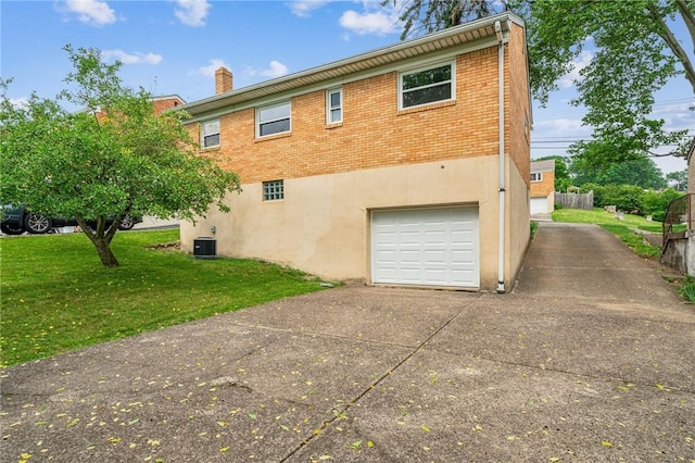 4154 Steiger St, Castle Shannon, PA 15234 - back of property with a garage, driveway, a yard, brick siding, and a chimney