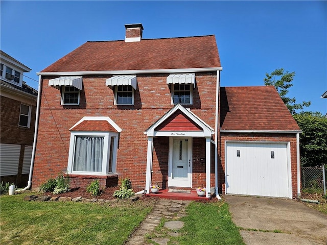 619 Ridge Ave, New Kensington, PA 15068 - view of front of property featuring driveway, brick siding, a chimney, and roof with shingles
