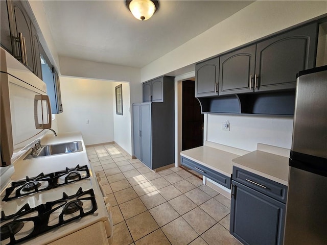 619 Ridge Ave, New Kensington, PA 15068 - kitchen featuring white appliances, light tile patterned floors, and light countertops