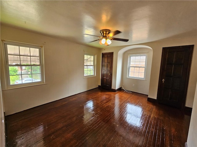 619 Ridge Ave, New Kensington, PA 15068 - unfurnished room featuring hardwood / wood-style floors, ceiling fan, and arched walkways
