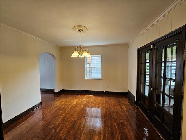 619 Ridge Ave, New Kensington, PA 15068 - empty room featuring arched walkways, dark wood-style flooring, ornamental molding, a chandelier, and french doors