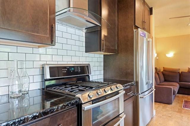 548 Penn St, Verona, PA 15147 - kitchen with stainless steel appliances, wall chimney range hood, dark stone countertops, and backsplash