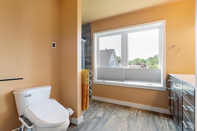 548 Penn St, Verona, PA 15147 - full bath with plenty of natural light, vanity, a shower with door, and wood finished floors