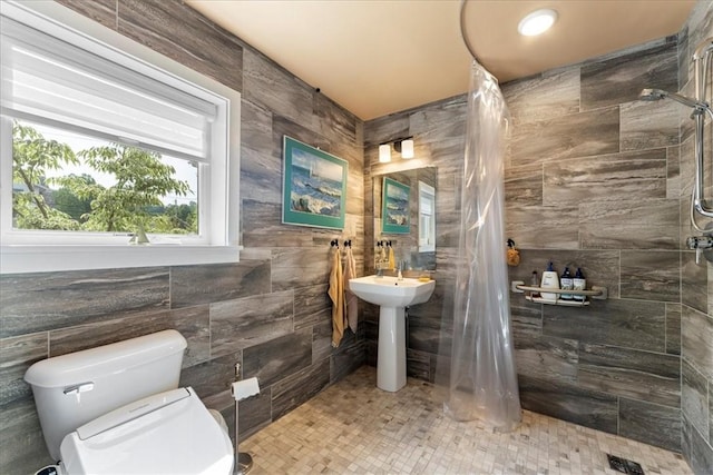 548 Penn St, Verona, PA 15147 - bathroom with a tile shower and tile walls