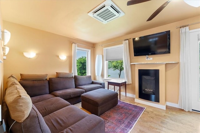 548 Penn St, Verona, PA 15147 - living area featuring a ceiling fan and a fireplace