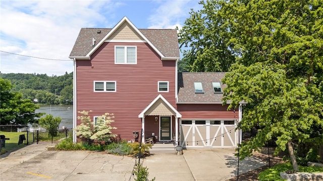 548 Penn St, Verona, PA 15147 - victorian-style house featuring concrete driveway, roof with shingles, and a garage