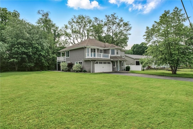 11504 N Shore Dr, Conneaut Lake Cra, PA 16316 - view of front facade with driveway, a garage, and a front lawn