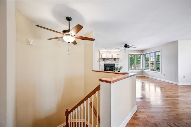 11504 N Shore Dr, Conneaut Lake Cra, PA 16316 - corridor with wood finished floors and an upstairs landing