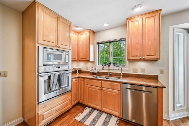 11504 N Shore Dr, Conneaut Lake Cra, PA 16316 - kitchen with appliances with stainless steel finishes, light brown cabinetry, light wood finished floors, and recessed lighting