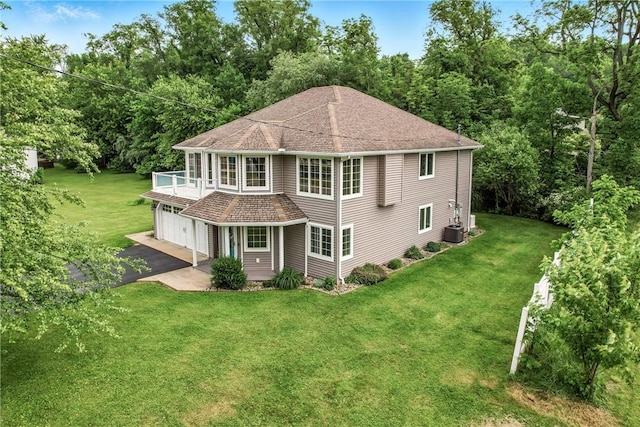 11504 N Shore Dr, Conneaut Lake Cra, PA 16316 - view of front of house with a garage, a front yard, driveway, and roof with shingles