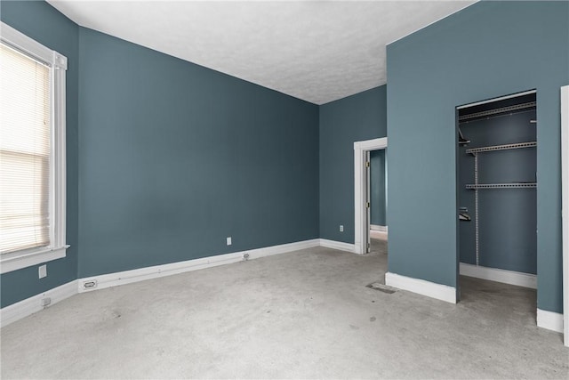 330 Jefferson Ave, City Of Washington, PA 15301 - unfurnished bedroom with a closet, carpet, and a walk in closet
