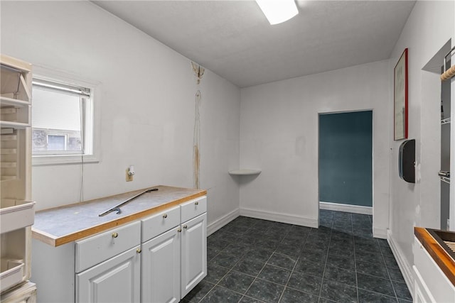 330 Jefferson Ave, City Of Washington, PA 15301 - laundry area featuring dark tile patterned flooring and baseboards