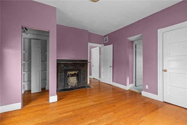 330 Jefferson Ave, City Of Washington, PA 15301 - unfurnished living room featuring light wood-style flooring and a fireplace with flush hearth