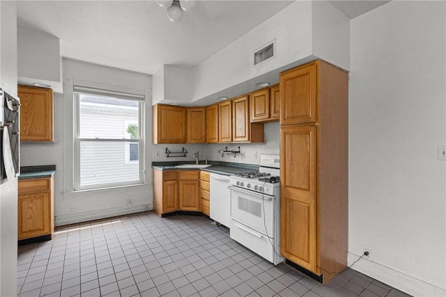 330 Jefferson Ave, City Of Washington, PA 15301 - kitchen featuring white appliances, light tile patterned floors, and dark countertops