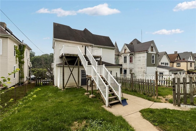 330 Jefferson Ave, City Of Washington, PA 15301 - rear view of house featuring a fenced backyard, stairway, and a residential view