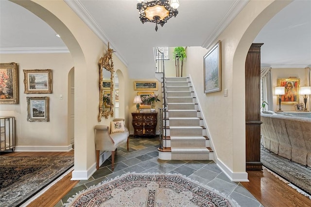1909 Highgate Rd, Upper St Clair, PA 15241 - foyer featuring crown molding, stairs, arched walkways, and wood finished floors