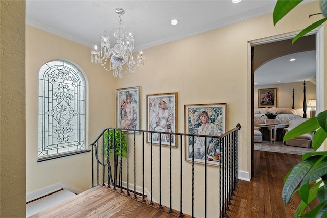 1909 Highgate Rd, Upper St Clair, PA 15241 - hallway featuring wood finished floors, a chandelier, recessed lighting, crown molding, and an upstairs landing