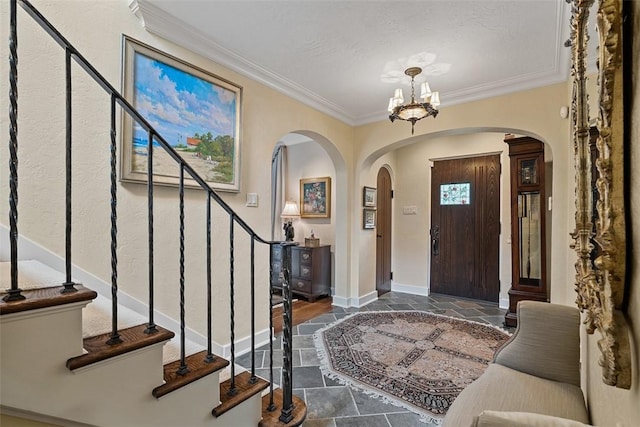 1909 Highgate Rd, Upper St Clair, PA 15241 - entryway with arched walkways, stone tile floors, ornamental molding, a chandelier, and stairs