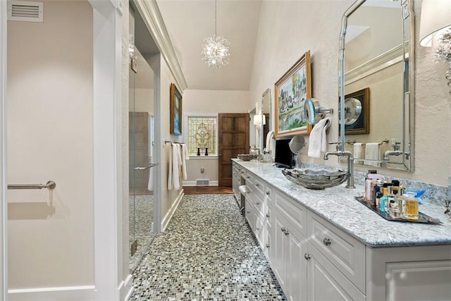 1909 Highgate Rd, Upper St Clair, PA 15241 - bathroom featuring double vanity, a chandelier, a shower stall, and lofted ceiling