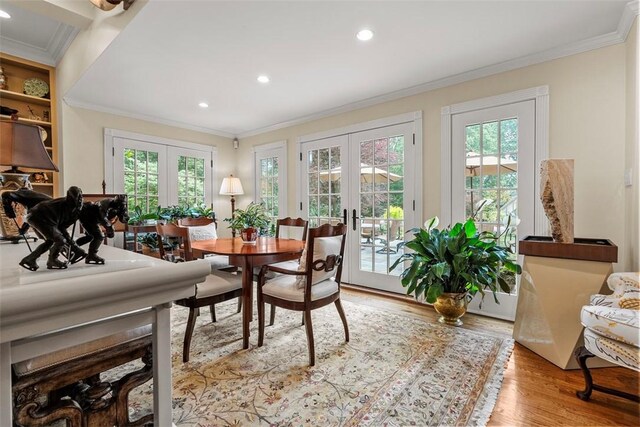 1909 Highgate Rd, Upper St Clair, PA 15241 - dining room featuring french doors, wood finished floors, crown molding, and recessed lighting