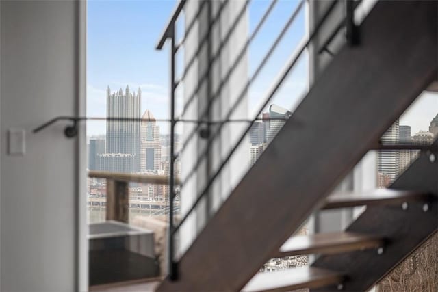 310 Cola St, Mt Washington, PA 15203 - stairway featuring a city view, plenty of natural light, and a wall of windows