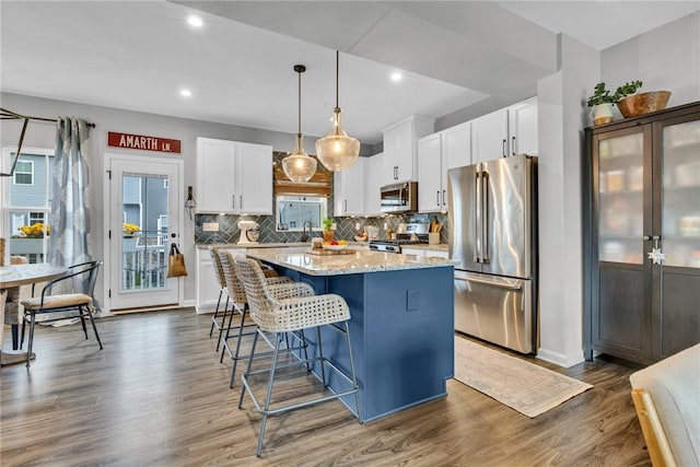 620 Amarth Ln, Cranberry Twp, PA 16066 - kitchen with stainless steel appliances, a center island, white cabinets, dark wood-style flooring, and recessed lighting