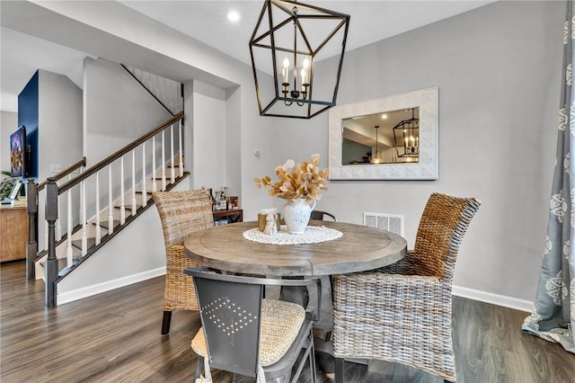 620 Amarth Ln, Cranberry Twp, PA 16066 - dining area with stairs, wood finished floors, and a chandelier