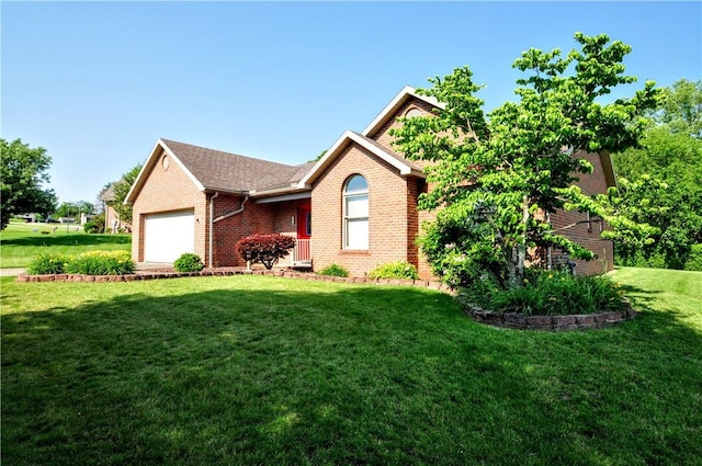 23 Naples Dr, North Union Twp, PA 15401 - ranch-style home with a garage, brick siding, and a front yard