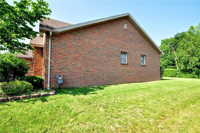 23 Naples Dr, North Union Twp, PA 15401 - view of side of property with a yard, brick siding, and roof with shingles