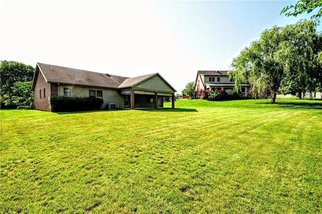 23 Naples Dr, North Union Twp, PA 15401 - rear view of house with a lawn