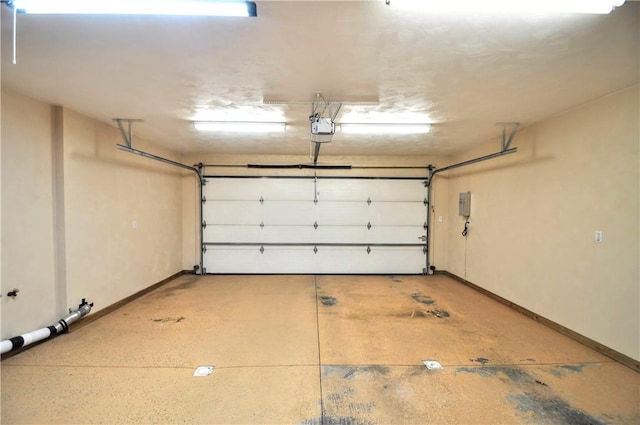23 Naples Dr, North Union Twp, PA 15401 - garage featuring a garage door opener and baseboards