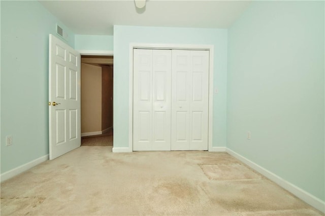23 Naples Dr, North Union Twp, PA 15401 - unfurnished bedroom featuring light colored carpet and a closet