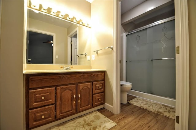 23 Naples Dr, North Union Twp, PA 15401 - bathroom featuring wood finished floors, vanity, and a stall shower