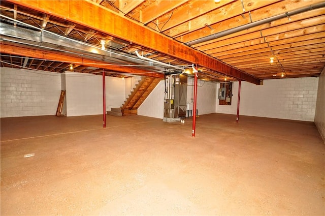 23 Naples Dr, North Union Twp, PA 15401 - below grade area featuring stairs, heating unit, and electric panel